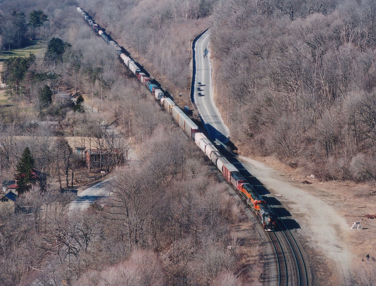 Power combinations on CN in the middle 2000s were entertaining, to say the least. Here is CN #396 eastbound past the site of the old Dundas station with WC 6926, BNSF 7885, 8018 and CN 5526 up front. The CTG lists the leader as "SD40 upgraded to SD40-3 in 1997/98. Lettered GEC Alsthom (owned by Connell Finance) relettered Wisconsin Central beginning in July 2003." The SD40-2 BNSFs are former BN, same numbers. A CN SD60F trails. For those interested, this image was shot with Medium format film, Fuji 800 ISO. There are actually still a few film junkies out there in this digital age. :o) A good hike to the edge of Dundas Peak provides this tremendous view out over the valley.