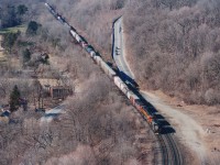 Power combinations on CN in the middle 2000s were entertaining, to say the least. Here is CN #396 eastbound past the site of the old Dundas station with WC 6926, BNSF 7885, 8018 and CN 5526 up front. The CTG lists the leader as "SD40 upgraded to SD40-3 in 1997/98. Lettered GEC Alsthom (owned by Connell Finance) relettered Wisconsin Central beginning in July 2003." The SD40-2 BNSFs are former BN, same numbers. A CN SD60F trails. For those interested, this image was shot with Medium format film, Fuji 800 ISO. There are actually still a few film junkies out there in this digital age. :o) A good hike to the edge of Dundas Peak provides this tremendous view out over the valley.