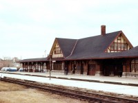 A Tale of CP and "Heritage".  The grand old CP station in West Toronto had outlived its usefulness. CP and the City of Toronto were in negotiations to restore it. The plan was for making the station once again a popular destination, this time as a Farmer's Market. But in a shocking turn of events, the project, and the discussion, never came to fruition. During the wee hours of Thursday morning, November 25, 1982, while the city was asleep, CP demolition Crews launched a raid on the venerable old structure and, in almost 'military style' has reduced the 71 year old building to rubble before anyone could yell "Holy Crap"!!!!! The Toronto Mayor (Eggleton) was infuriated, and in a letter to CP President Stinson called the act illegal, amounting to vandalism and corporate irresponsibility. But, CP considered this event mission accomplished. CP was eventually charged with demolition without a permit and failing to stop demolition when ordered. Moving in during the dead of night as in this case still has to be one of the most shocking acts carried out by this railroad even though they were up against a deadline for laying new track on the Toronto-Milton GO line, and the station was in the way.  Heritage lost.  Thanks, CP. (The Vans on the left in the photo are Union Gas company vehicles, using the parking lot on agreement with the railroad)