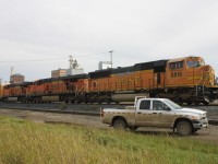 As I rounded the corner on Assiniboine Avenue I got quite the surprise as three bright orange locomotives stared back at me instead of the usual Canadian Pacific toasters that frequent the area.