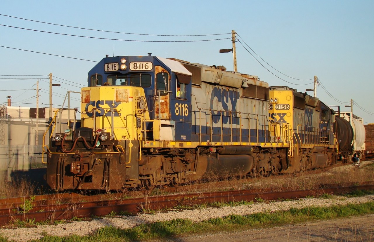 CSX train D718 is departing the Electric Yard with two SD40-2's and 19 cars. He brought 50 cars over from Rougemere Yard in Dearborn MI. (Canadian crew) earlier in the afternoon and is seen here at 19:20.