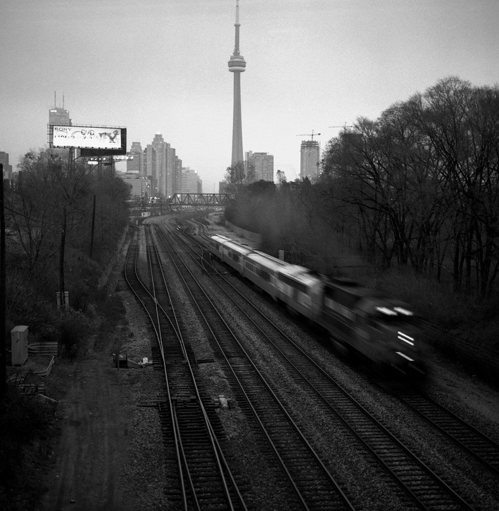 An empty 698 thunders under the Strachan Ave. overpass enroute to the VIA TMC.