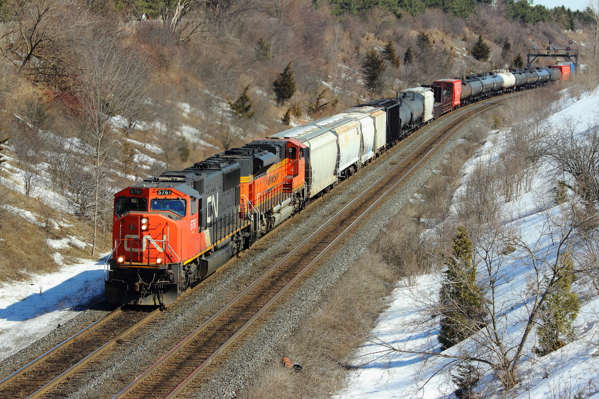 On this 13 degree, spring like day, some of the best trains I've seen in a while showed up. Without any notice, CN 309 comes around the Hilda Avenue bend with a BNSF in second.