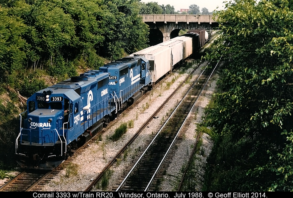Conrail train RR20 is gliding downgrade into the Windsor/Detroit rail tunnel on a hot July day in 1988.  RR20 had delivered cars to the CP yard in Windsor earlier and was headed back to River Rouge yard.
.