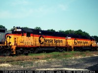 CSX GP38's #2012 and 2002, Trains Magazine "All American Diesel", sit quietly on the "sanding tracks" in the old C&O engine servicing facility in Chatham, Ontario in June of 1995.