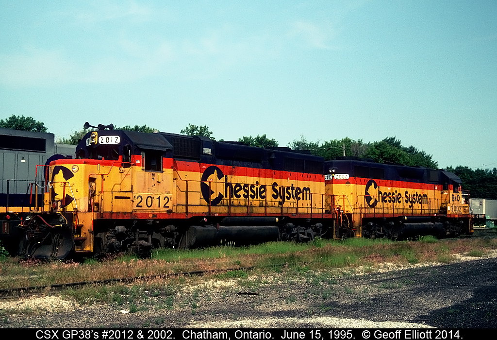 CSX GP38's #2012 and 2002, Trains Magazine "All American Diesel", sit quietly on the "sanding tracks" in the old C&O engine servicing facility in Chatham, Ontario in June of 1995.