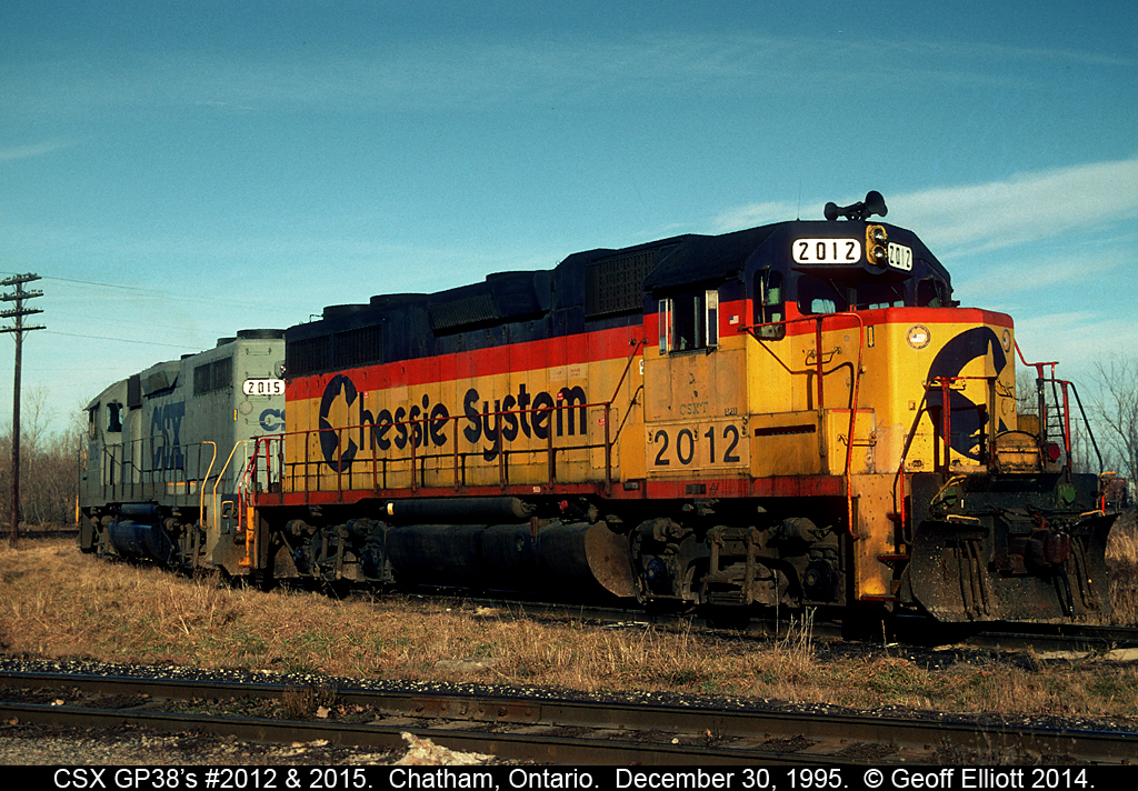 CSX GP38's 2012 and 2015, having delivered cars to the CP earlier, now rest on the the southeast connection to CP yard in Chatham, Ontario back on December 30, 1995.