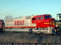 Brand new BNSF SD75M #8259, fresh from GMDD in London, tags along for the ride on a westbound 500 series train as it passes through Windsor bound for Chicago and delivery to BNSF.