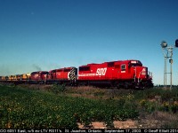 SOO 6051 leads 2 CP SD40-2's and 5 ex-LTV mining RS11's eastward as it is about to cross the Rochester Town Line, just east of St. Joachim, Ontario on September 17, 2003.  The ex-LTV units have been given another chance at life and are bound for the Morristown and Erie railroad.