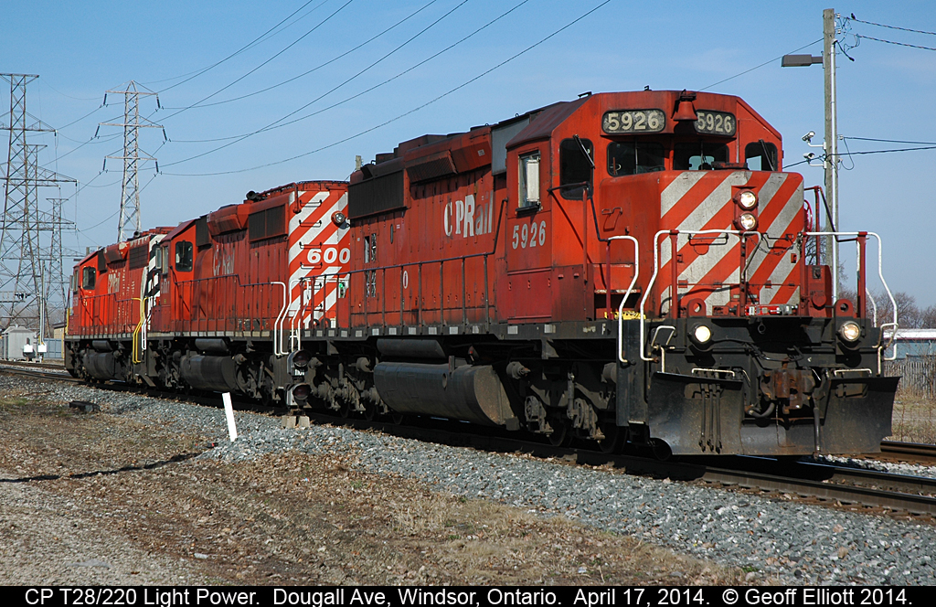 CP 5926, once owned by Ontario Hydro, leads a set of light power to Windsor yard.  Train is T28 but was also being referred to as 220, a grain re-route from Thunder Bay, as the power had delivered train 220 over to the CSX in Detroit during the early morning.