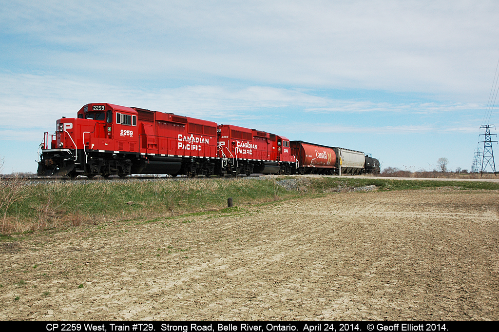 CP 'local' T-29 bounces over Strong Road crossing just east of Belle River while making it's way back to Windsor after a day of switching in and around Chatham.