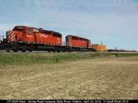 A nice pair of matched "CP Rail" SD40-2's, with 5926 leading, have a very long train #235 in tow as they cross Strong Road just east of Belle River.  Train was extremely long with about 2/3's of the train being empty platforms on the head end and the rest autoracks.  Great sounding 645's under the hoods here!!
