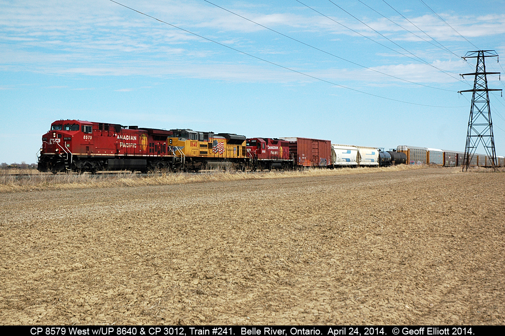 CP 8579 leads train #241 as it approaches Belle River with UP SD70ACe #8640 and CP GP38AC #3012 to round out a colorful elephant style trio on April 24, 2014.