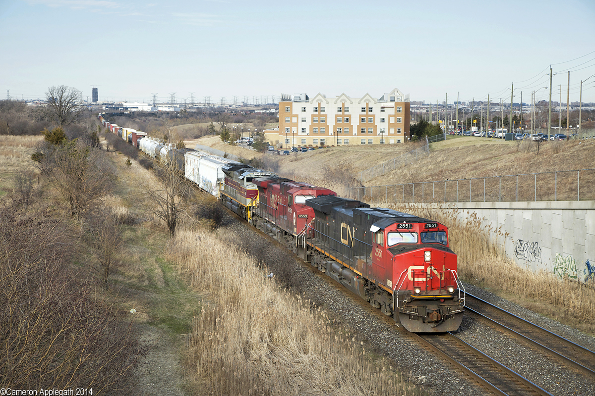 I have been waiting for months...

NS Delaware Lackawanna & Western heritage unit 1074 made its way up the previous night on CN #394, spending the following day at MacMillan Yard before heading out again on train #383. Here CN 2551, CP 9553, NS 1074 power this westbound up the hill at Knuckle Alley.