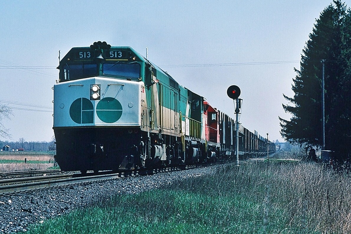 A friendly wave from the head end brakeman.....just look at that CP (Rail) freight …..well.....GO !


Always power short...leased power remains common even today....some things never change.... perhaps if CP took better care of their own units....


CP Rail Extra GO 513 west is in charge of a CP Rail ( a division of Canadian Pacific Limited) freight on the Galt Subdivision's near the Hornby Dip. 


May 3, 1980 Kodachrome by S. Danko


What's interesting:


GO 513 is a F40PH GMD built 1978, to Amtrak 413 in 1990


 Jim Adeney also caught GO 513 in CP Rail freight service, see:


  triplets   


sdfourty