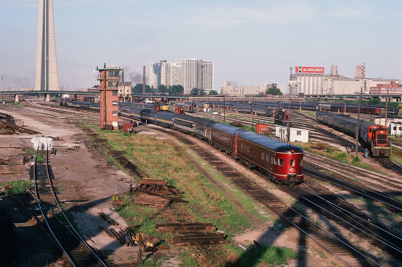 Just can't get enough !


July 24, 1980 the NRHA Toronto Convention.


 note the multiple private rail cars in the Spadina Coach yard


AND also in the Spadina Coach Yard:


1)  the Northlander


2) Tempo equipment


3) MLW FPA4


4) MLW S13's working the yard


5) far distance, look under the Spadina Ave overpass: a Tempo equipped MLW 3100 (orange body white cab)


6) at left is the lead to the new (at that time) GO downtown storage yard.


7) the never used TTR Control Tower


8) And of course the NRHA doubleheader special featuring Mountain Type CNR 6060 and VIA FP9A #6539 along with several NRHA member owned private rail cars.


9) that du Maurier billboard atop the silos


10) the shadow of the Bathurst Street overpass (with TTC PCC streetcars rumbling by...)


James Adeney captured this special at Hamilton Junction (near Bayview), see:


  NRHA at Bayview   


Night time looking east:


  Bathurst Street 1977   


CNR 6060 in full stride:


  at Sunnyside July 19, 1980   


What's interesting:


…. not a GE to be seen....anywhere !


...And yes that 6060 exhaust talk was great to listen to....


Looking east from the Bathurst Street bridge – just can't get enough – on July 24, 1980, Kodachrome by S. Danko