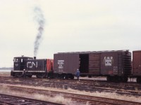 CN 40 switches the yard on a dull overcast September back in 1977 down near the Charlottetown waterfront. This unit and its other 70 ton partners were gone from the island by 1983. All rail activity, in fact, ceased on Prince Edward Island by 1989, and scenes like this are but a distant memory.