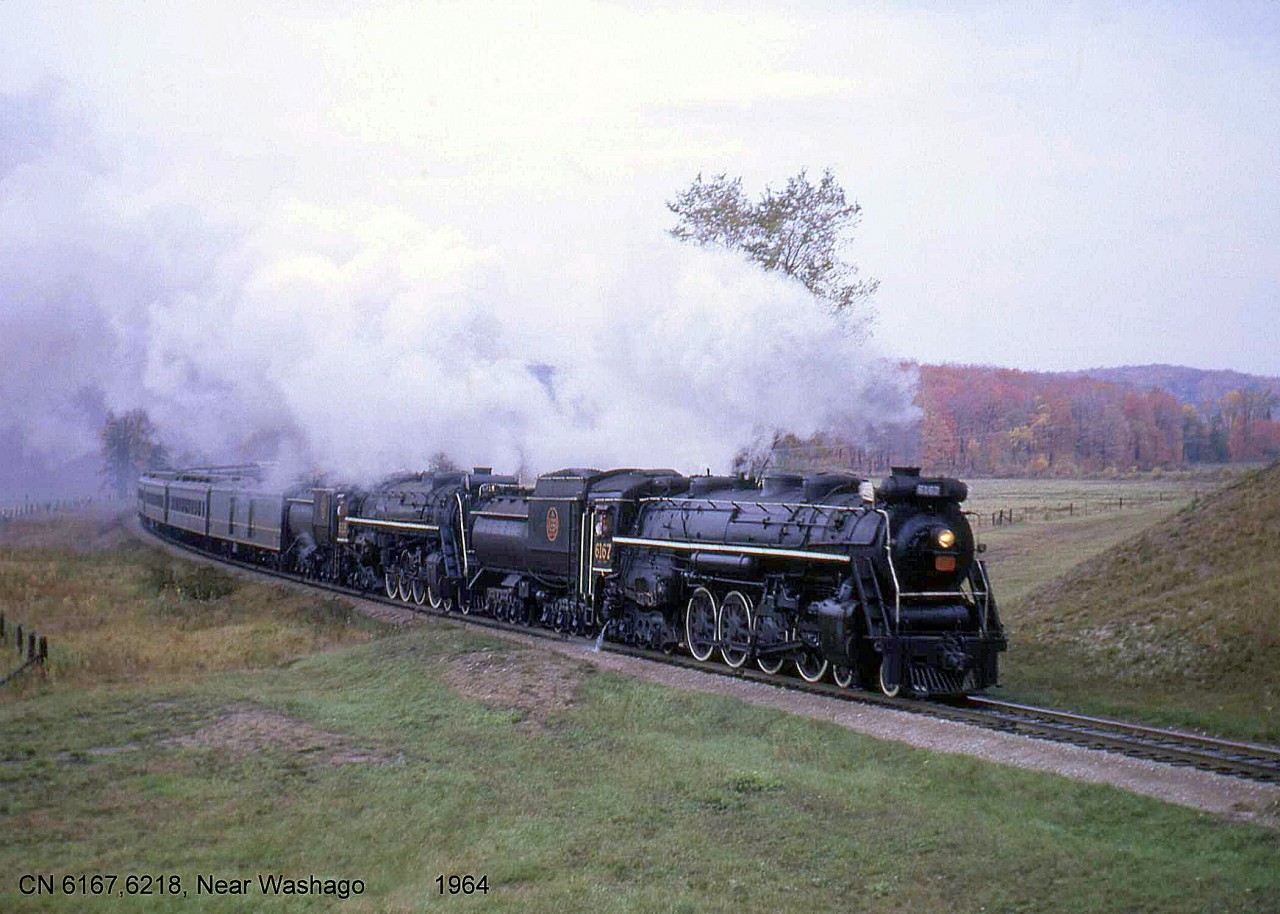 Upper Canada Railway Society excursion trips on Saturday and Sunday, September 26 & 27 1964, were a doubleheader run and done with CNR Northerns 6167 and 6218. This was to show the change of excursion engines from 6167 to 6218, as 6167's boiler tubes needed to be retubed in October 1964 (next month) which would prevent it from continuing in excursion service. On September 26th, the train ran from Toronto to Huntsville ON and back, departing from Union Station, heading north via the Bala and Newmarket Subs, and returning to Toronto via the Newmarket. The train is shown here on one of its runbys north of Washago, heading south on the Newmarket Sub near present-day Gravenhurst.

6167's final excursion run would be from Toronto to Brantford and back the next day. She would be stored at Spadina Roundhouse before being donated to the City of Guelph three years later to be put on static display near the CN (now VIA) Station. CN 6218's final excursion was in 1971, and it is now on display in Fort Erie ON.