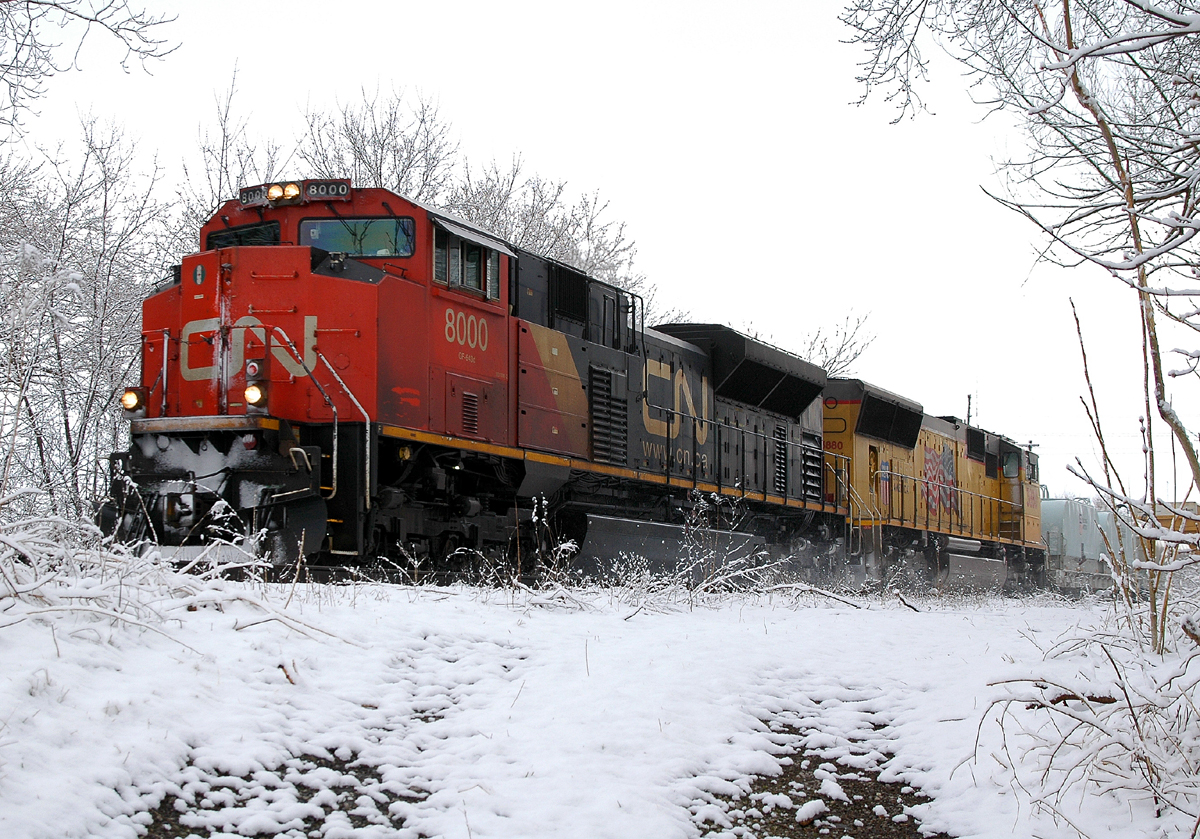CN 8000 - UP 3880 power a short 331 through Brantford after a late april snowfall