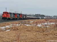 Headed by a consist that only CN could assemble, 372's train passes Colborne behind CN 2421, 5469, 1412, and 4131, with BCOL 4645 as the mid-train DPU. Apparently the 2421 has had DPU equipment installed, which is the only of CN's 2400 series C40-8M's to have this equipment that I'm aware of. The 1412 and 4131 are headed only as far east as Belleville for a stint on Belleville based local 518, previously held by the 7000 and 7039, which went west to Mac Yard, likely for routine service and inspections, on 369 the previous day. 1806hrs.