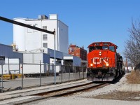 A Sunday morning 511 job is navigating the chicane around the 101 year old Kellogg's Cereal plant on their way back from lifting 7 cars at the CN-CP interchange adjacent to the CP Quebec street yard (geographically north of the CN yard). The plant is slated to close later this year, ending one of the longest-lasting London-area business operations. A couple of years back a tractor-trailer was struck by the yard job at this same crossing in what has become known as the "cereal killer accident". CN 4772 is noteworthy for having the entire conductor's side long hood painted solid black.