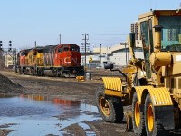 A 1980's vintage Goderich-built Champion motor grader that undoubtedly saw plenty of action this winter rests at CN London East along with CN 434's power. The 1975 graduate of GMD and the grader were both built by companies that no longer manufacture in southwestern Ontario. 