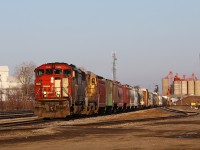 Two 1980's designed locomotives representing vastly different motive power philosophies bring a late-running CN 435 down track 6 at Racecourse yard. The classic Draper-Taper in the lead was purchased new in 1989, while the trailing unit, CN 2041, is actually a year newer having been built as CN 8541 in 1990. The train made an unscheduled stop in Woodstock after the low-hanging air hose connection between the 21st and 22nd cars snagged the crossing resulting in the train going into emergency.