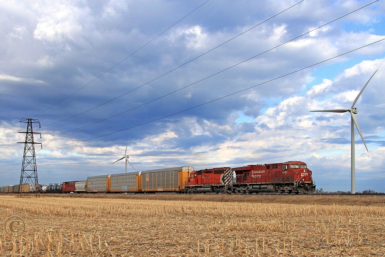 CP 8821 with multi-marked CP 5749 work eastward with train 234 at mile 88.1 on the CP's Windsor Sub.