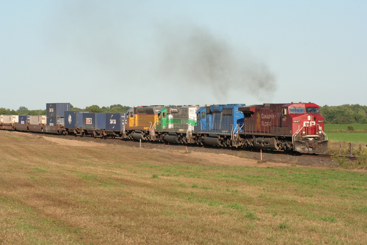 CP 245 accelerates westward out of Wolverton siding with three leaser locomotives of different paint schemes trailing. Note, at this time, Wolverton was not CTC yet.