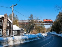 With veteran engineer Wayne Thompson at the helm, the Credit Valley Explorer eases across the Forks Of The Credit bridge at 10 MPH.