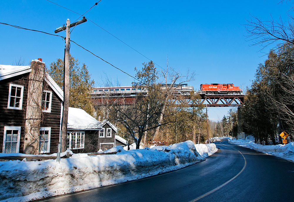 With veteran engineer Wayne Thompson at the helm, the Credit Valley Explorer eases across the Forks Of The Credit bridge at 10 MPH.