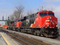 CN-2335 a EF-644-M leading loco with CN-5600 a SD-75I as second locos and  CN-2179 C-40-8W the 3 locos are pulling a convoy of containers of 12,000 feets according of the CN controller on CN route 120 to Halifaqx Nova Scotia 