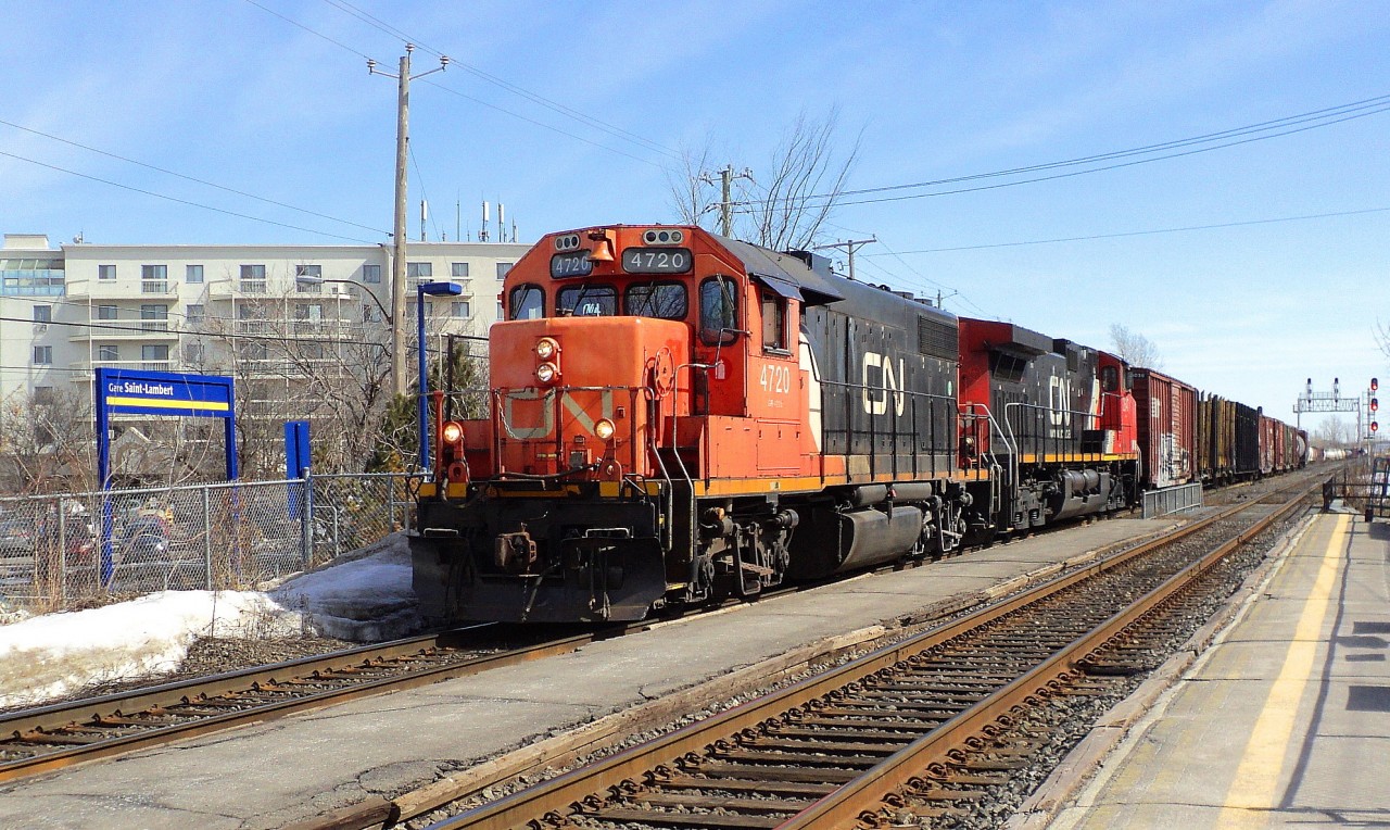 CN-4720 a emd GP-38-2 leading loco with CN2547 a EF-644-e coming out of the north siding with freights cars coming from Southwark yard going to Tachereau yard near Dorval