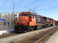 CN-4720 a emd GP-38-2 leading loco with CN2547 a EF-644-e coming out of the north siding with freights cars coming from Southwark yard going to Tachereau yard near Dorval