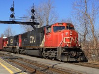 CN-5727 a SD-751-s leading loco of a convoy of mix cars crossing from South main track to north main track clearing South track for Via rte 15 coming from Halifax N.S.late plus pull CN-5667  