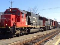 GAS GAS covoy of empty gas cars pull by CN-5461 a EMD SD-60 leading loco with CN-5797 a SD-751 check behind CN-5797 a BNSF car that serve as a BUFFER CAR betwing the loco and gas cars it is a fédéral law to have a buffer car to separe the loco of dangerous loads al so one at the end of the convoy