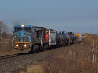 CN 509 led by IC 2463 (former LMS) and CN 5682 passes eastbound at Fairweather Road after just departing Sarnia.