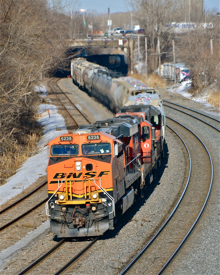 BNSF where you least expect it. With the influx of oil trains into Quebec, BNSF power can pop up when and where you least expect it. BNSF 6236, which came into Montreal last night on an oil train, is being used by CN on a local transfer from the Port of Montreal to Taschereau yard. Trailing are two CN geeps: CN 7019 & CN 4726. For more train photos, click here.