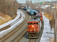 <b><i>2 trains and 1 hi-railer</i></b> At far right on the south track is CN 711  with CN 2431 and CN 2657, departing Turcot West after changing crews. To the left is VIA 57 with VIA 918 leading three LRC cars. Further to the left is a CN hi-railer, stopped on the freight track. For more train photos, click <a href=http://www.flickr.com/photos/mtlwestrailfan/>here.</a>