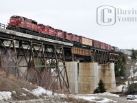 Another image from my series of CP freight 221-01 from April 2009, this time as the consist (CP 4657- CP 8203- CP 8206- CP 8207) soars over the Nipigon River bridge. My trusty 2004 Honda Civic (or the 'Silver Bullet' as I call it) sits below beside the then still intact CN Kinghorn Subdivision.
<br>
<a href="http://www.railpictures.ca/?attachment_id=14547"> An image</a> of the consist departing Schreiber after the  crew change.