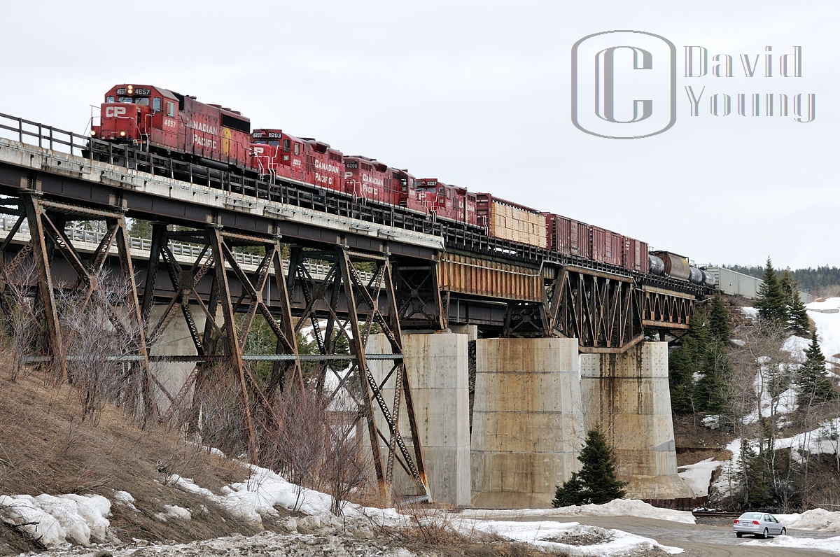 Another image from my series of CP freight 221-01 from April 2009, this time as the consist (CP 4657- CP 8203- CP 8206- CP 8207) soars over the Nipigon River bridge. My trusty 2004 Honda Civic (or the 'Silver Bullet' as I call it) sits below beside the then still intact CN Kinghorn Subdivision.

 An image of the consist departing Schreiber after the  crew change.