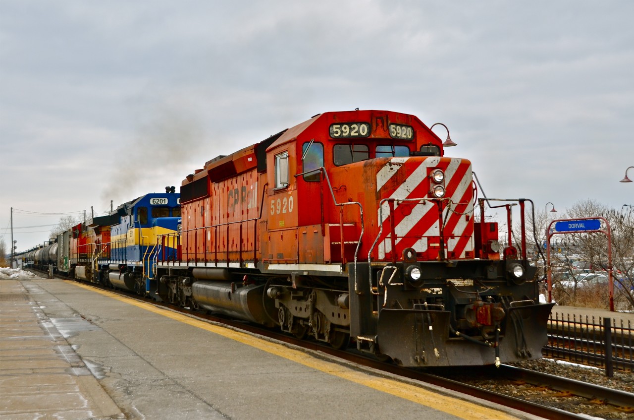After being held about 90 minutes due to trackwork, CP 642 heads east through Dorval with a nice lashup comprised of CP 5920, DME 6201 ("City Of Pierre") and BNSF 5709 (a somewhat rare by BNSF standards AC400CW). For more train photos, click here.
