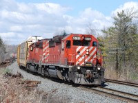 CP 234 glides down the Niagara escarpment west of Milton, ON with a pair of action red SD40-2's in a classic scene which could have been taken 20 years ago.