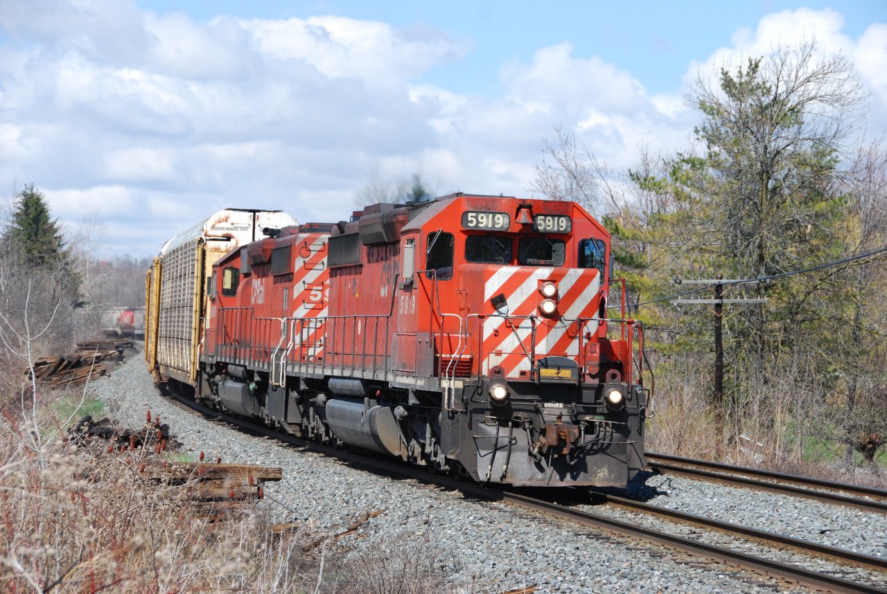 CP 234 glides down the Niagara escarpment west of Milton, ON with a pair of action red SD40-2's in a classic scene which could have been taken 20 years ago.