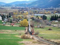 This is a view looking eastwards down the Coldstream Valley with the Monashee mountains in the distance. CN(WC)3027 is the lead unit on this pick-up freight which has recently left Lavington and is approaching Vernon.