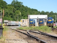 <b>Stuart Street Shops: Beginning of the End.</b> RLK 1756, a GP7u sits in front of the shops, boarded up and having turned her last wheel. RLK 1757, a GP10 (or GP9u, if you prefer)sits with GP18, RLK 1808 awaiting for servicing or return to service on the property. In the coming years, then owner RailAmerica will divulge themselves of this older RLK power scrapping numerous units, including the boarded up 1756 and I believe 1757. The 1808 ended up going to Cando's Barrie-Collingwood operation in Utopia, Ontario.