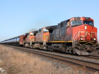 CN 710 oil train heading east bound at Waterworks Road lead by CN2571 with BNSF5528 and BNSF5828.