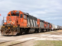 CN4702 with CN4136 and CN7245 finished with the grain elevator switch and about to pick up tank cars by Imperial Oil.