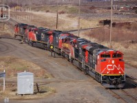 After combining three power sets sitting in Port Arthur, the crew brings 7 units across town to Neebing. In the mix is WC SD40-2 6006