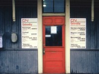 Many years ago this scene could be repeated at almost every CN station across the country. No doubt this will bring back memories for the older fellers on this site. The ivory frame, orangy-red door, grey board/batten appearance of the old wooden structure and those flimsy brittle plastic signs advertising how to connect with the railroad. I wonder where all those signs have gone? The "Zenith" phone number was brought to my attention. Just one of those changes that go unnoticed in everyday life.  To reach "Passenger" as noted on the board, dial "O" for operator and ask for the Zenith number (49900) and the operator would look in her notebook at the switchboard and make the connection for you, thereby relieving either party of any long distance changes. This was the forerunner of the "1-800" system which came into existence around 1967. Grimsby CN station was destroyed by fire on December 31, 1994...........ah!! so THATS where these particular signs have gone.....:o(